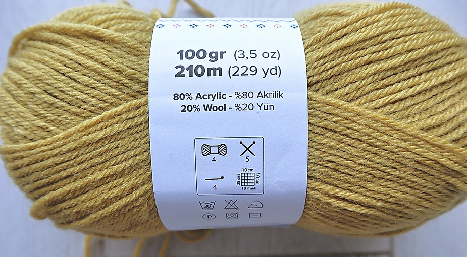 Ball of Yarn. La Mia Wool Easy in the colorway Mustard