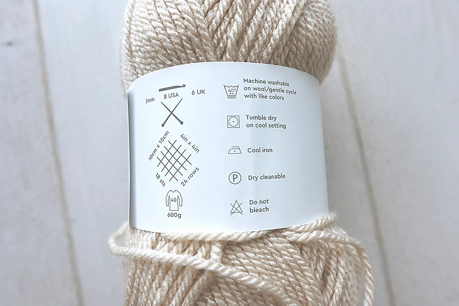 The back Label of a skein of paintbox yarns simply aran in the colorway beige