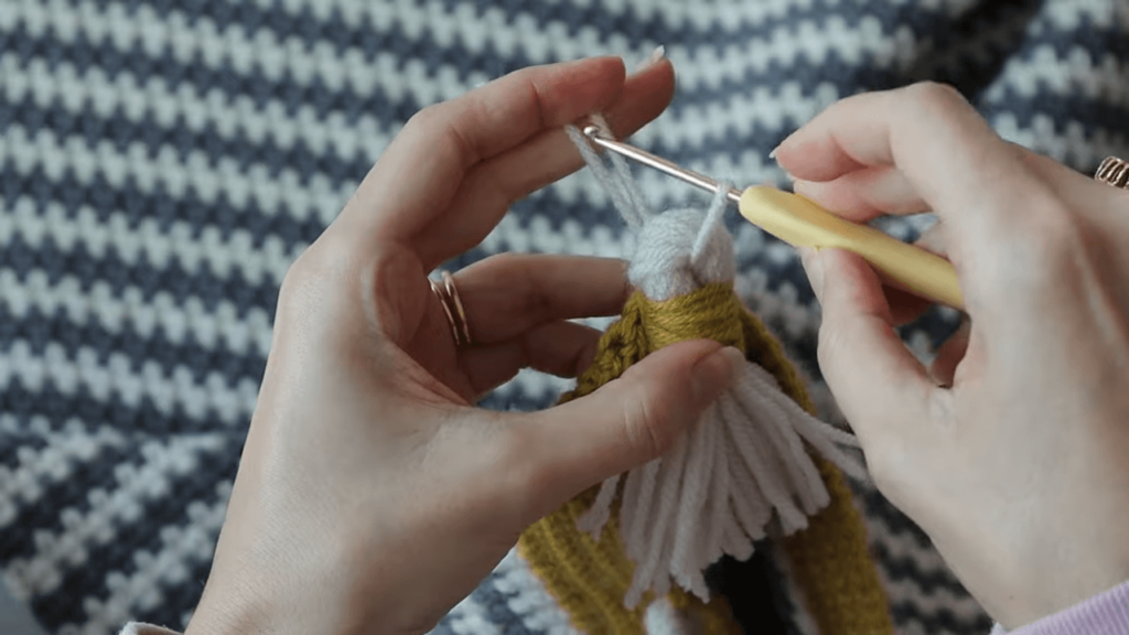 attaching tassels to a crochet blanket